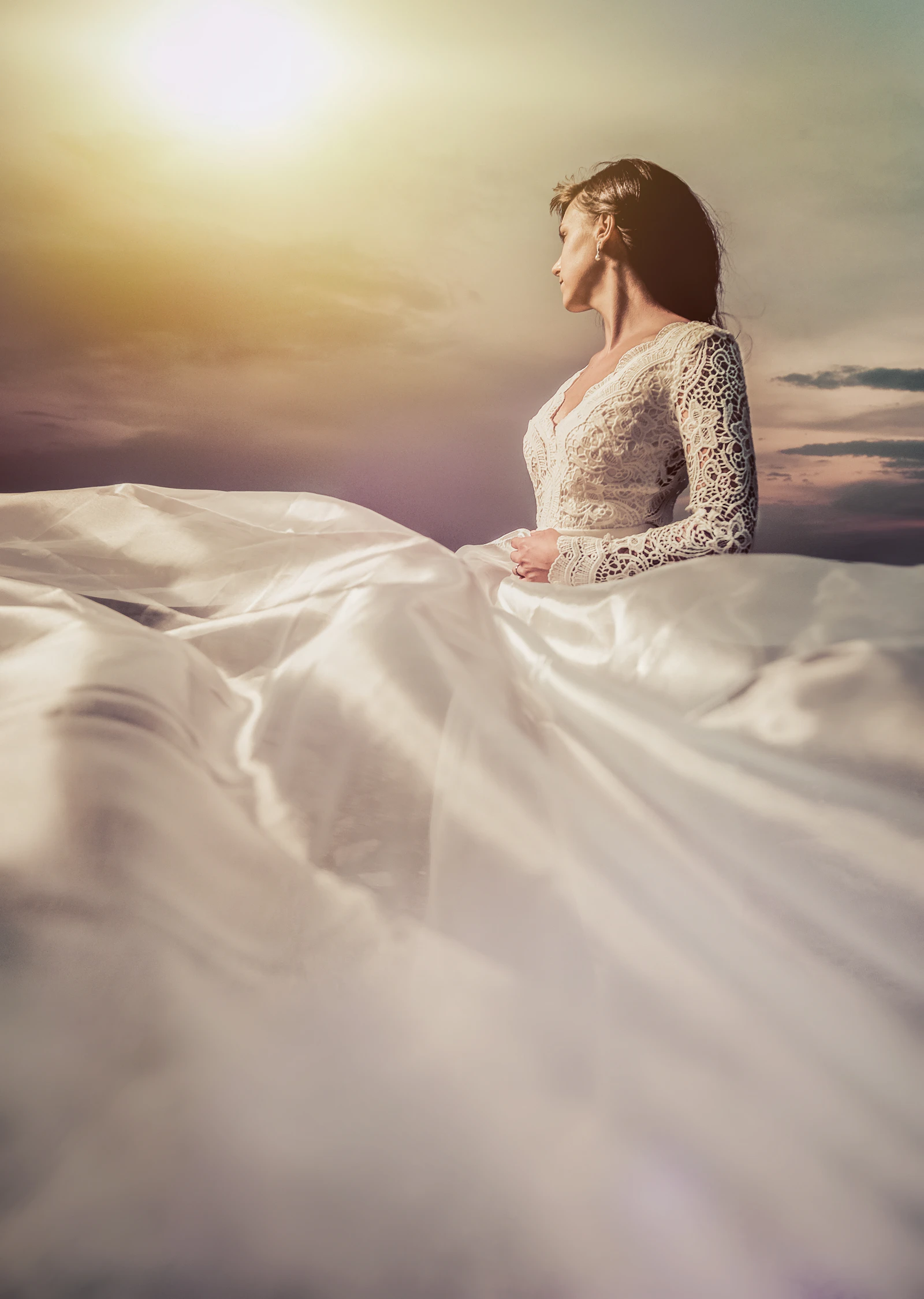 A close-up of bridal lace catching soft sunlight