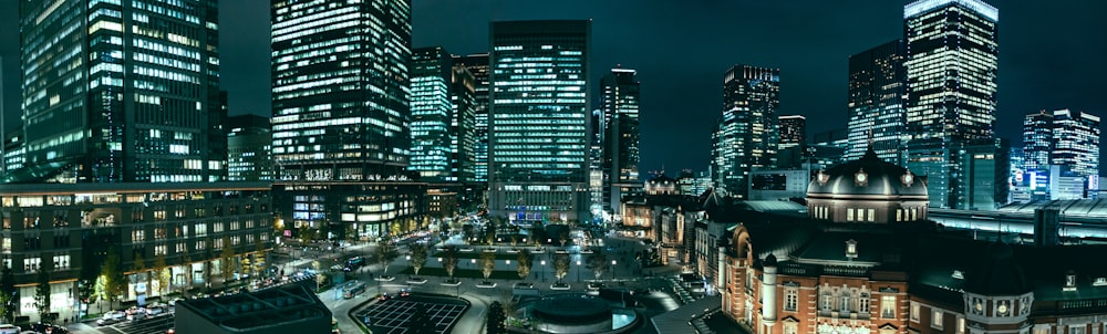 gray high rise buildings at night