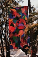 Close-up of a vibrant printed vinyl banner hanging outdoors