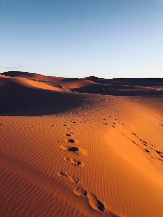 footsteps in sand of desert in Errachidia Province Morocco