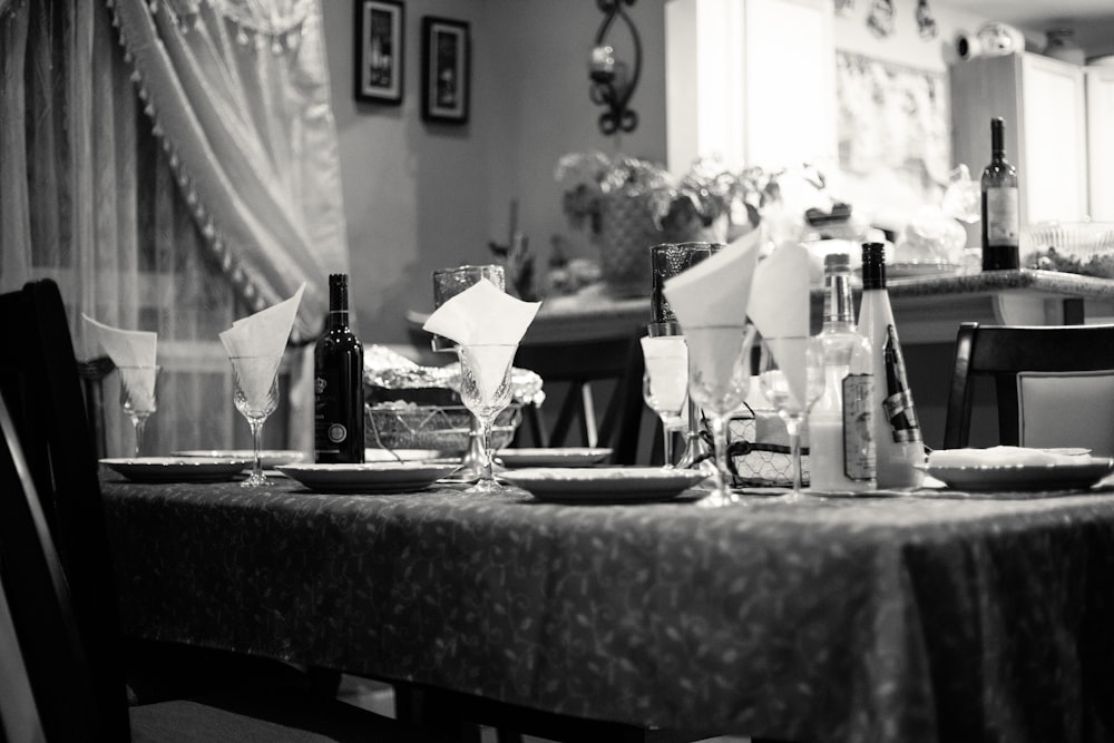 grayscale photography of fine dining table set