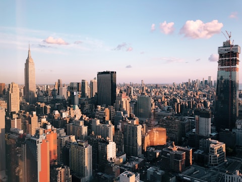 A cityscape showing municipal buildings and urban infrastructure under clear daylight.