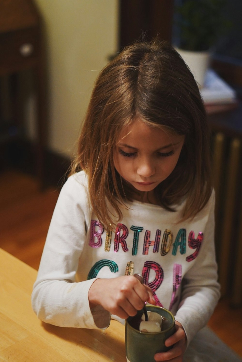 child holding cup