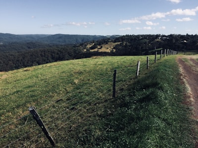 A scenic view of rolling hills with several marked property boundaries.