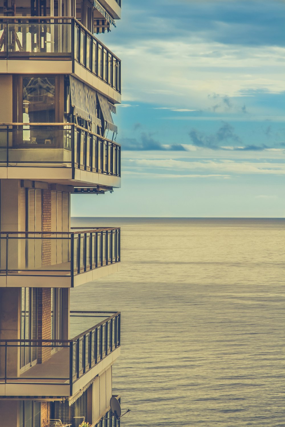 high-rise building with ocean background