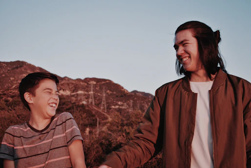 A smiling family enjoying a scenic mountain hike together.