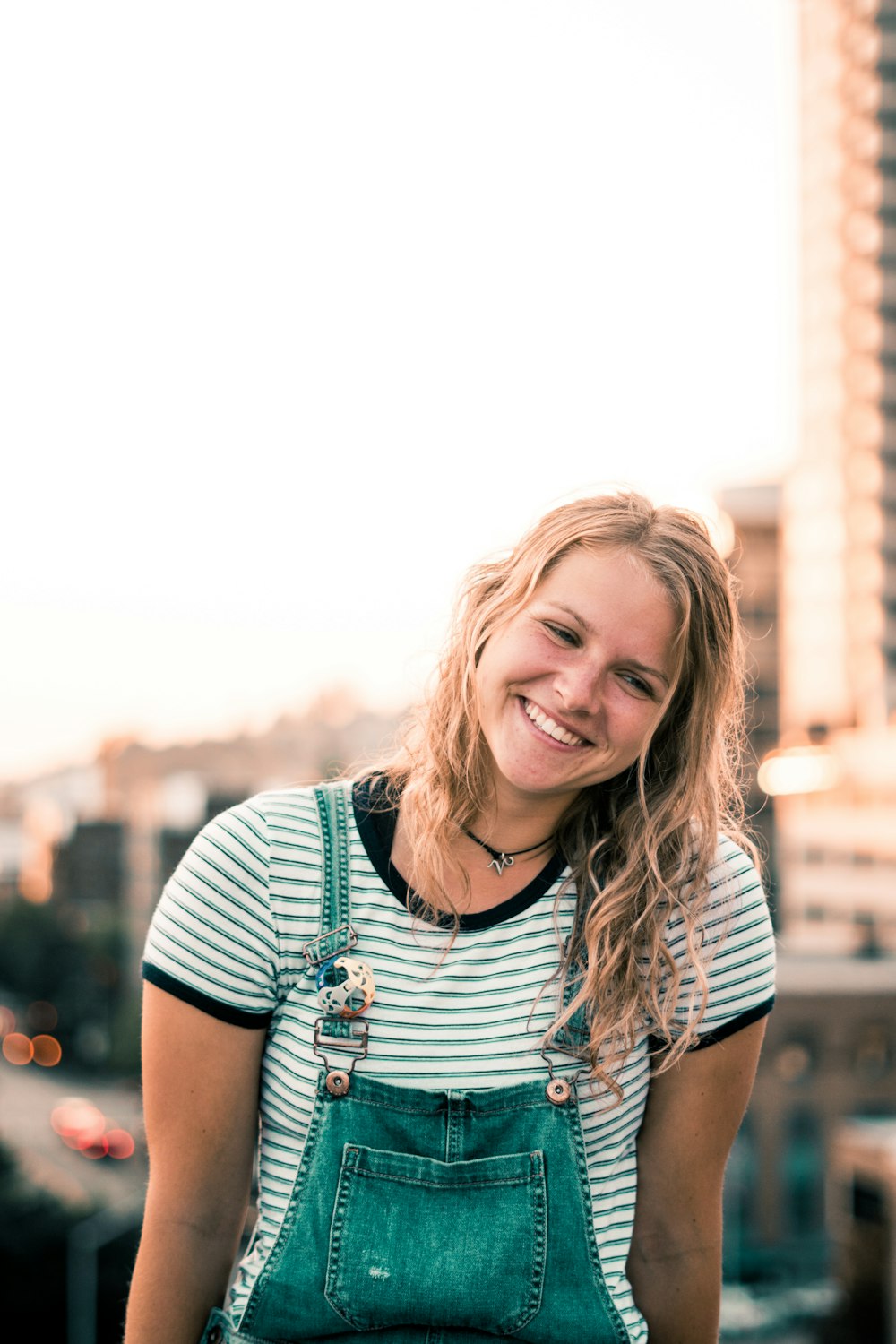 woman in blue denim dungarees