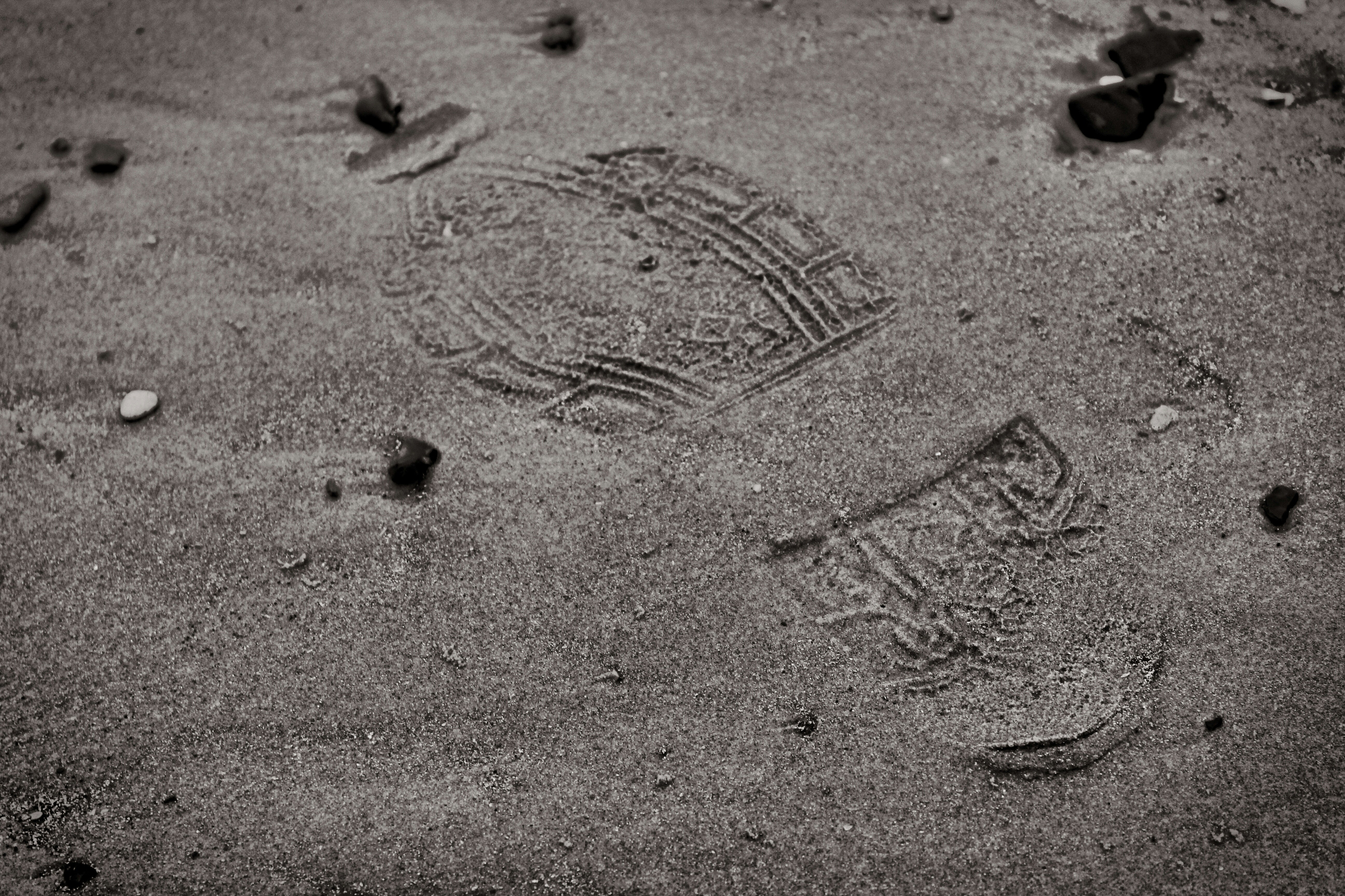 closeup photo of brown sand with shoe print