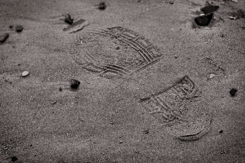 closeup photo of brown sand with shoe print