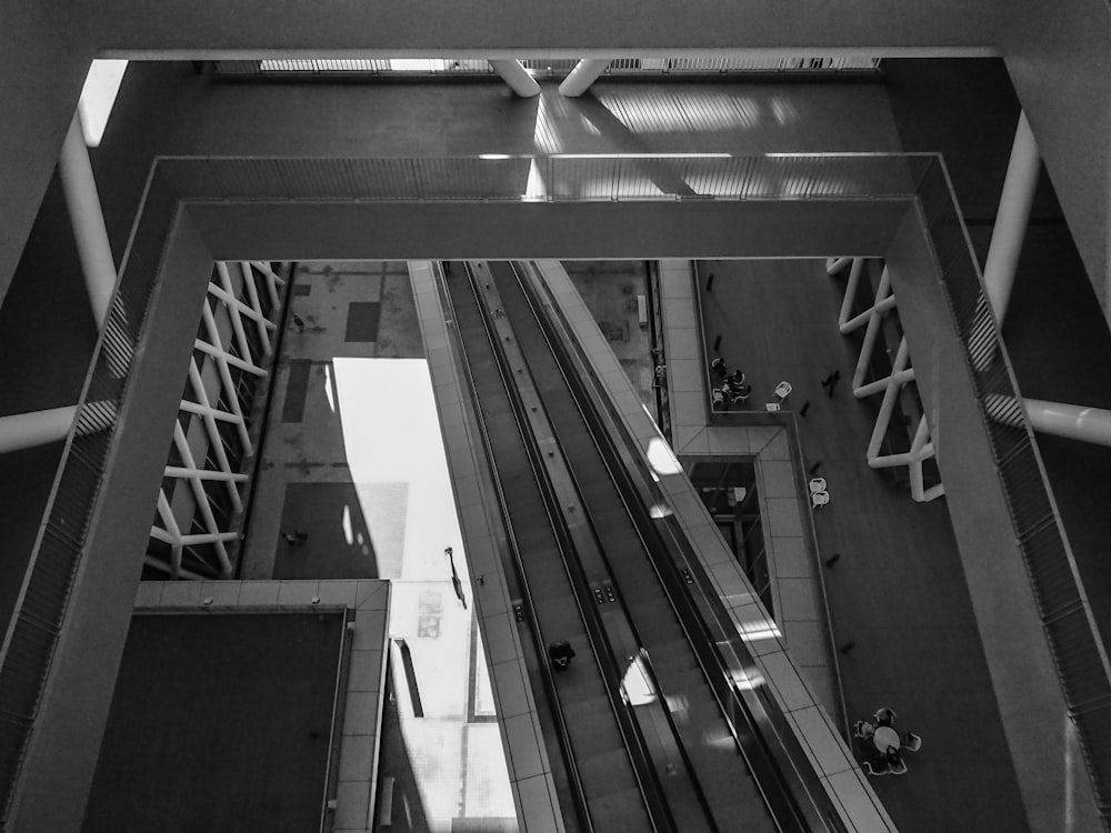 grayscale photo of escalator