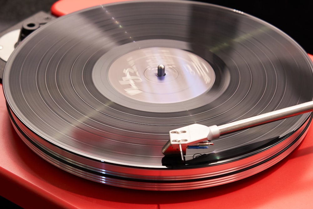 red and grey vinyl player