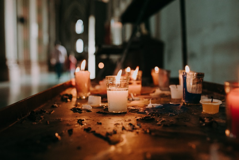 white pillar candles lighted in room