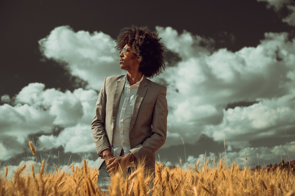 man standing on wheat field