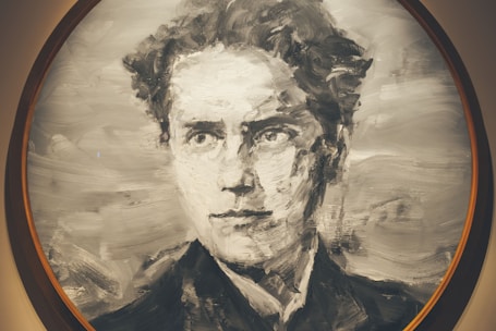 A monochromatic portrait painting of a person with a focused and serious expression. The brush strokes are bold, creating a texture that gives the image a sense of movement and depth. The artwork is enclosed within a circular frame.