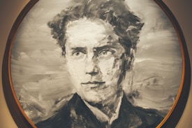A monochromatic portrait painting of a person with a focused and serious expression. The brush strokes are bold, creating a texture that gives the image a sense of movement and depth. The artwork is enclosed within a circular frame.
