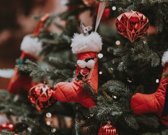 pre-lit Christmas tree with assorted Christmas tree ornaments