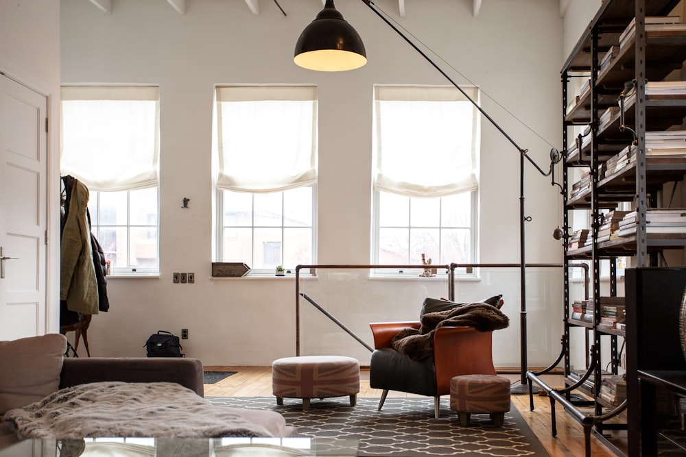 black floor lamp beside sofa chair