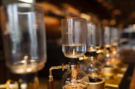 close-up photography of glass dispensers