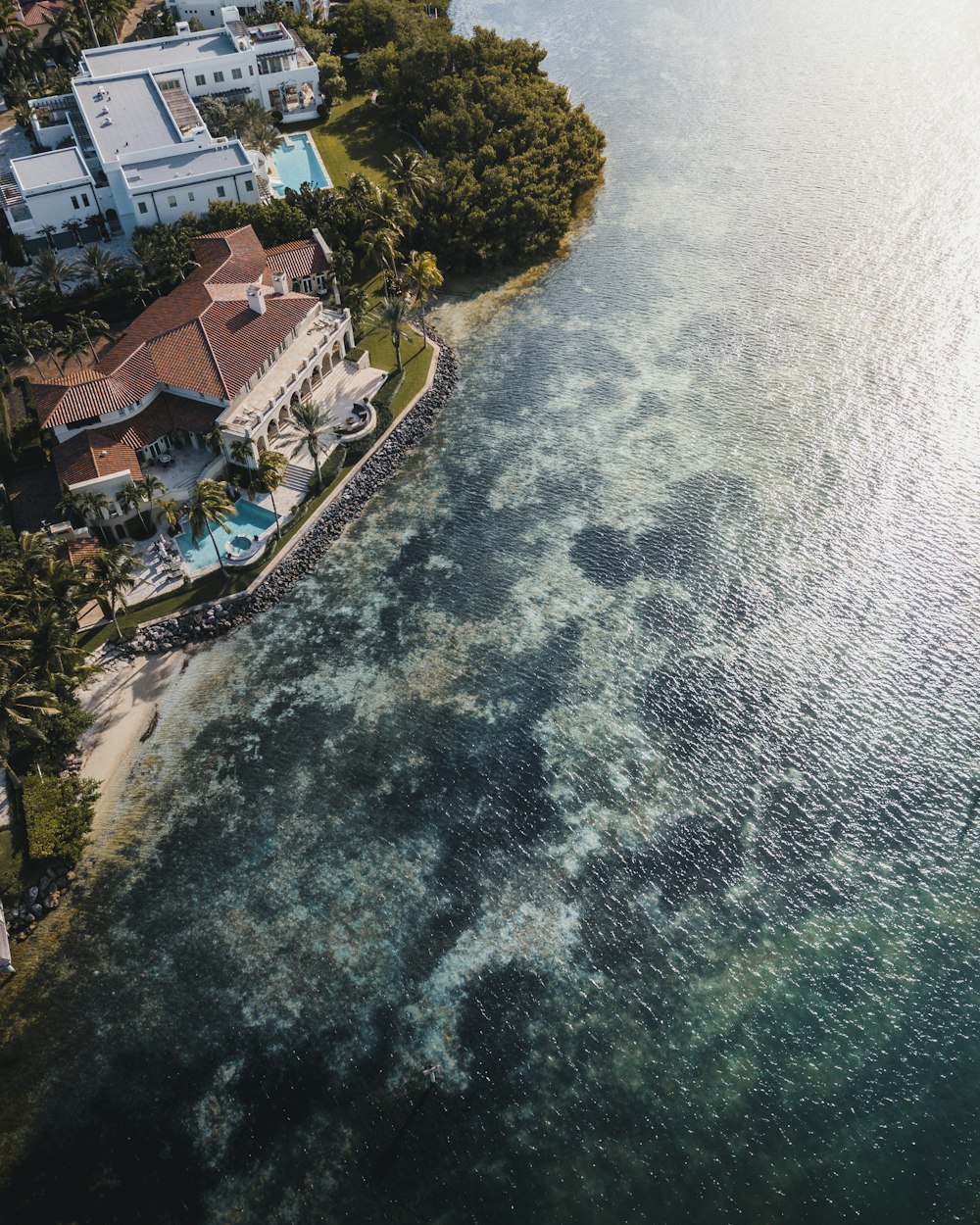 aerial photography of buildings near body of water during daytime