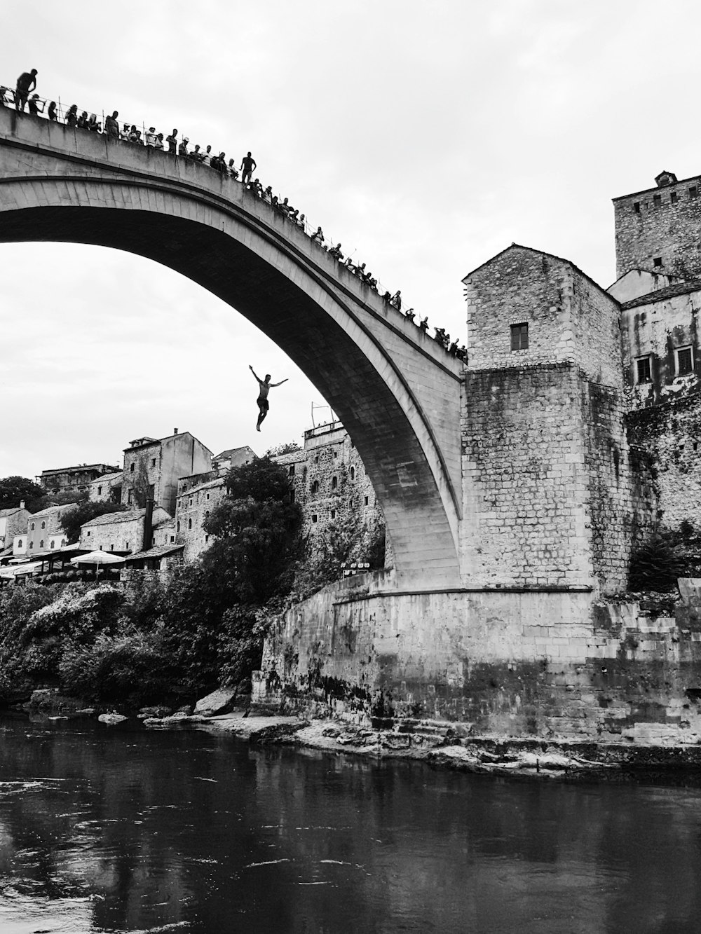 gray concrete bridge grayscale photo