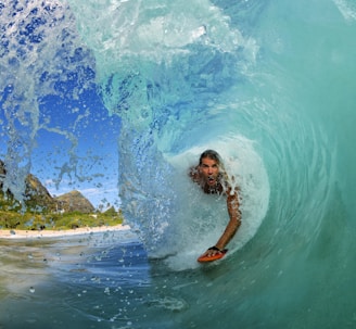 man surfing on ocean waves during daytime