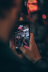A professional photographer capturing a 360-degree photo of a modern storefront.