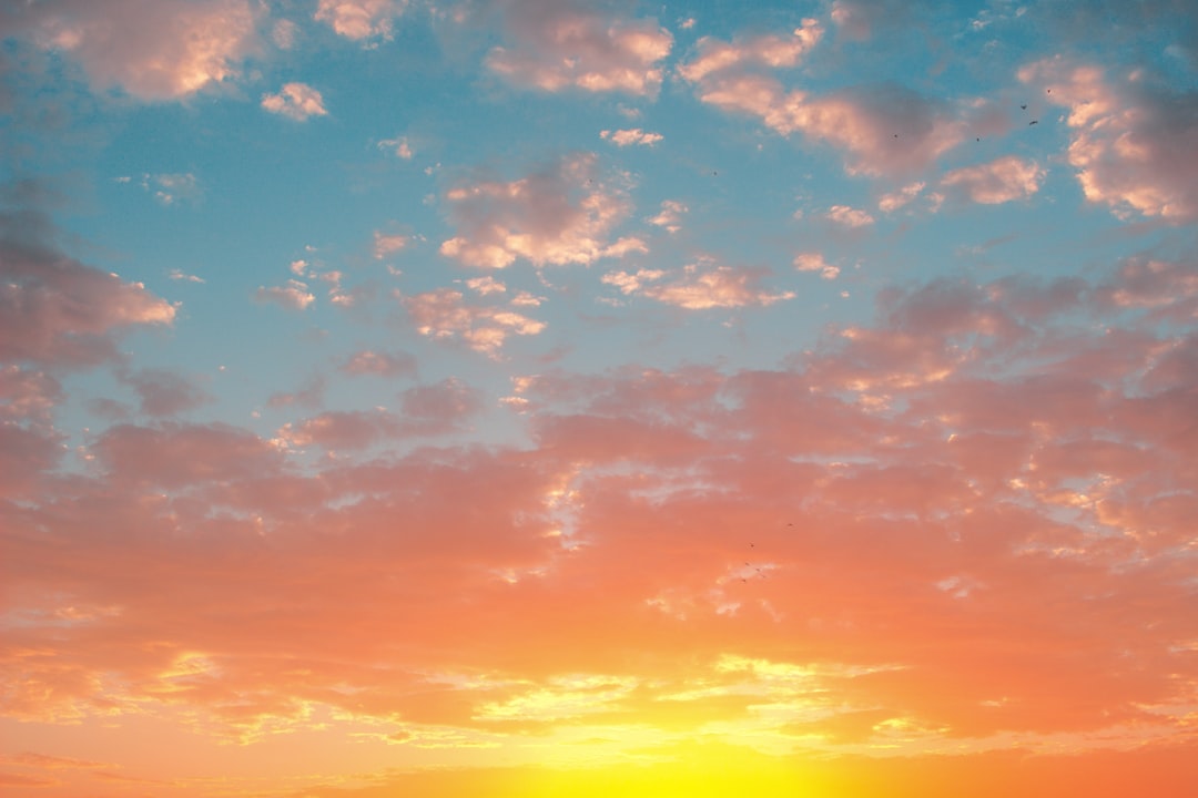 orange and blue sky with clouds,