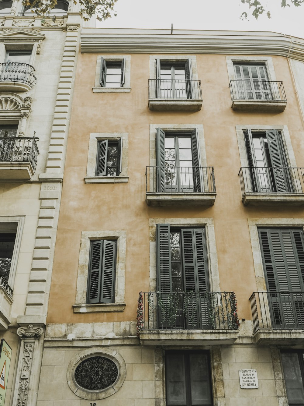 brown building with balcony during daytime