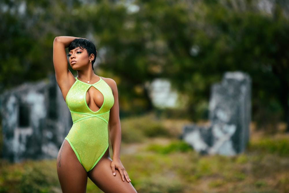 woman standing in green halter bikini during daytime