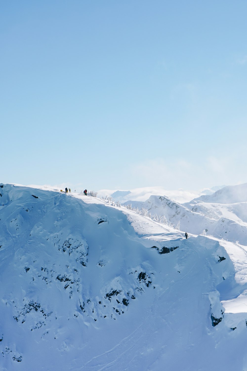 mountain covered with snow under clear blue sky