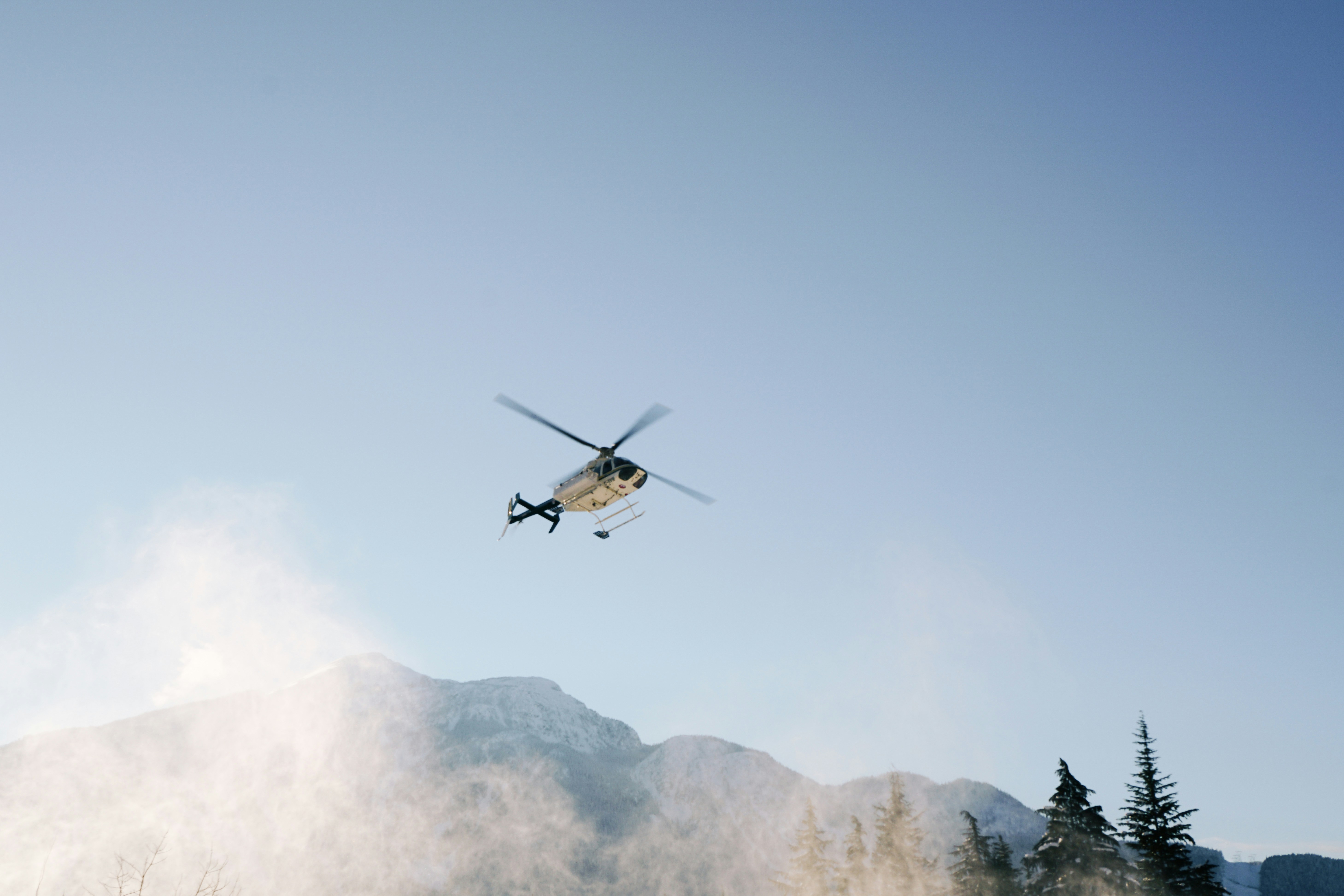 white helicopter on flight