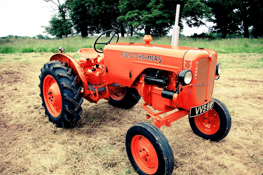 orange tractor on field