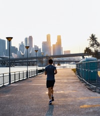 man jogging on street during daytime