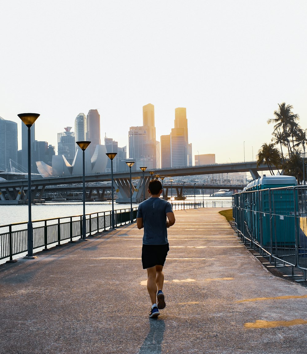 man jogging on street during daytime