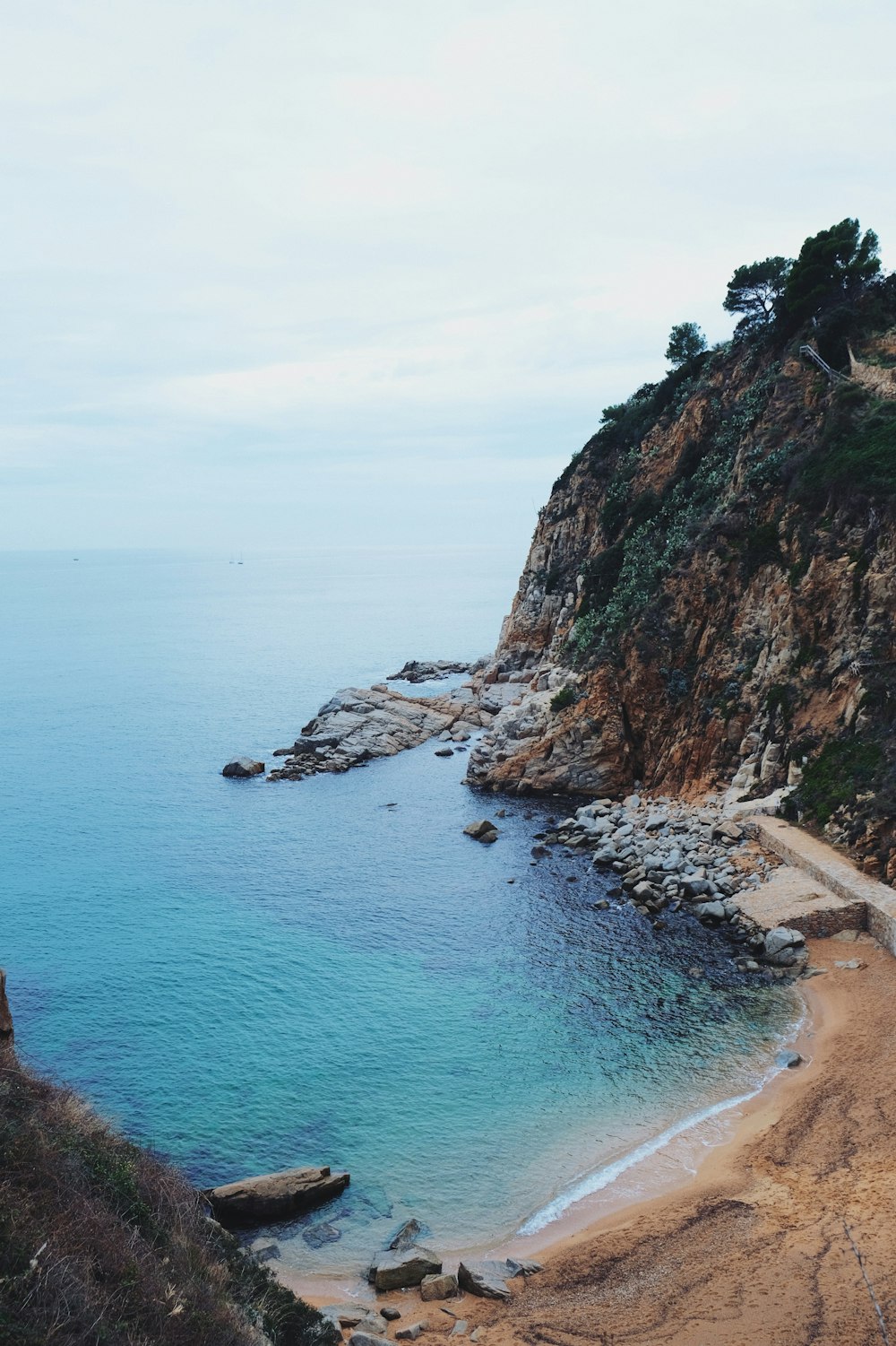 aerial photography of mountain and blue sea