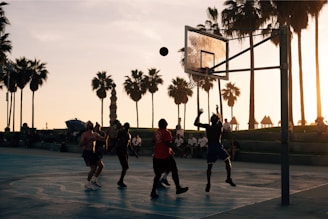 group of men playing basketball