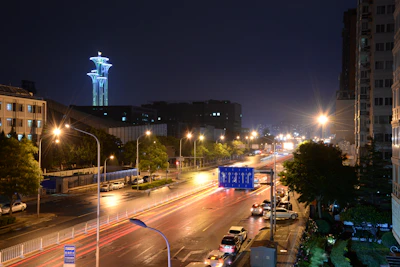 A city street at night lit warmly by vehicles equipped with Broled LED illumination