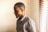 man standing near window