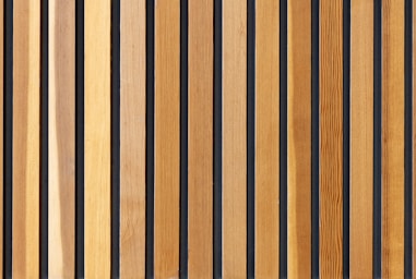 two brown wooden wall decors