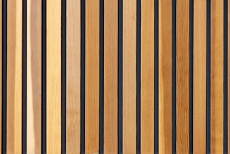 two brown wooden wall decors
