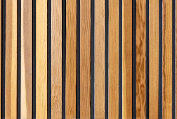 two brown wooden wall decors