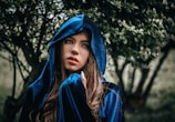 A model wearing a cloak inspired by ancient lore.