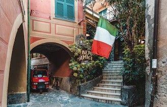 red auto-rickshaw under arch walkway