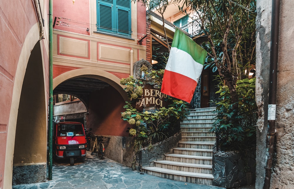 red auto-rickshaw under arch walkway