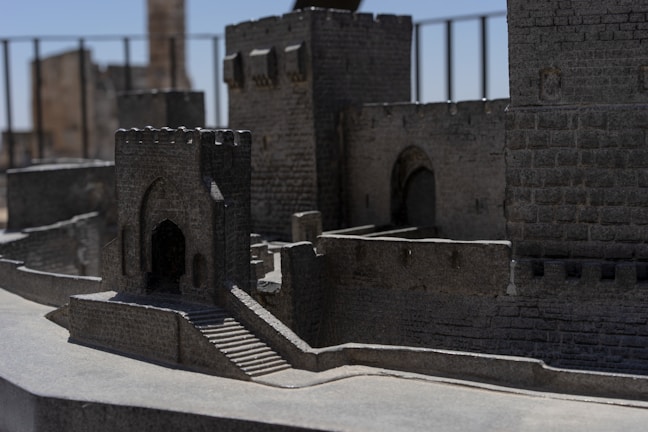 A whimsical 3D printed miniature castle with intricate windows and towers.