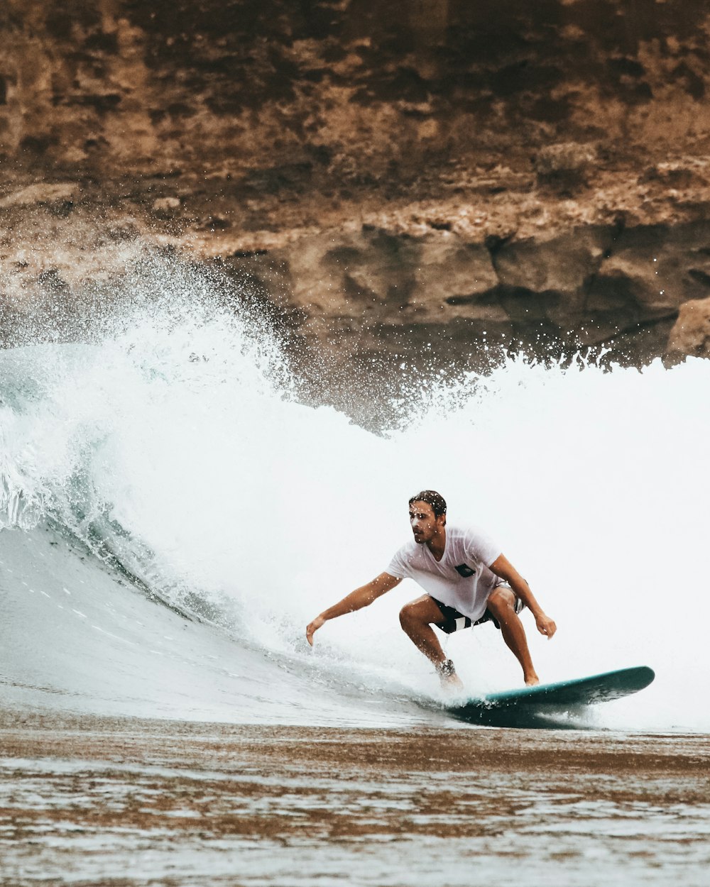 man riding on surfboard