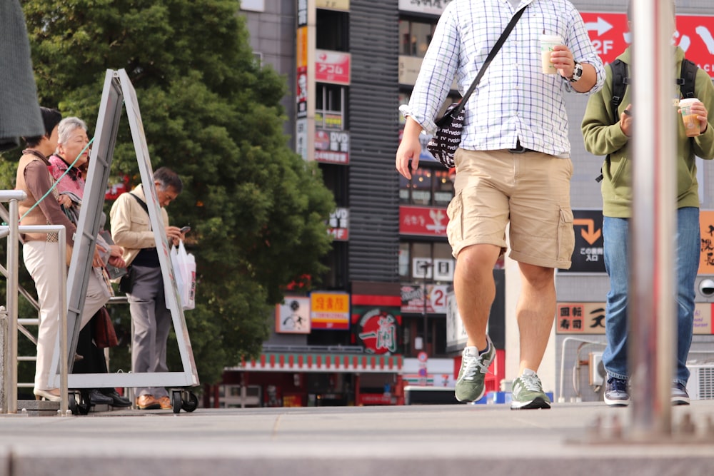 man walking near post