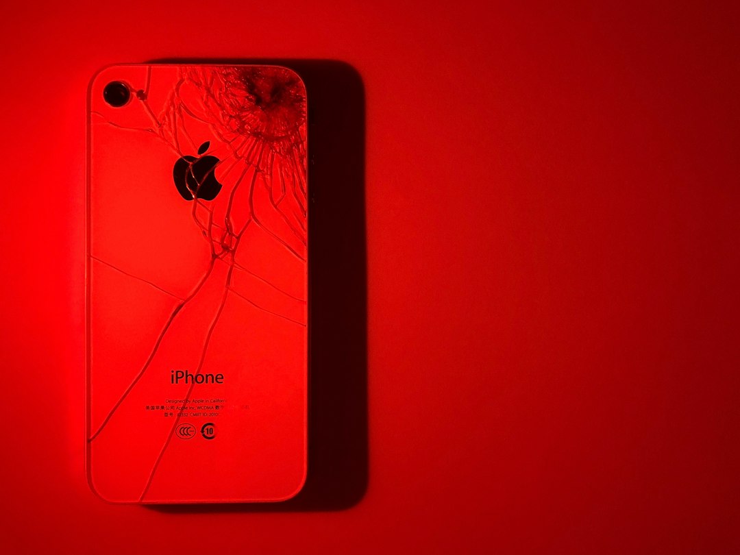 white iPhone under red light