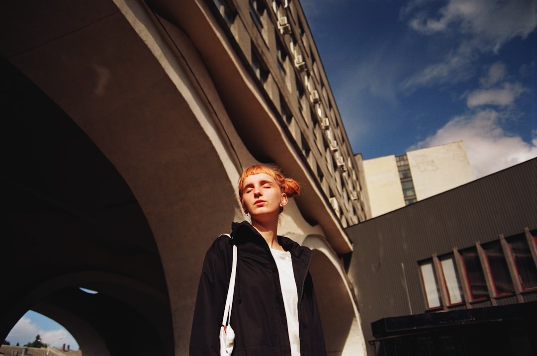 person standing under the tunnel during daytime