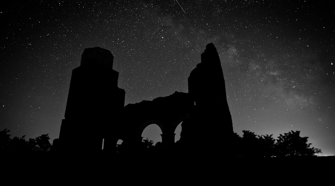 silhouette of ruins at nighttime